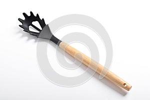 Black silicone spoon for draining of spaghetti