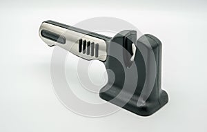 Black and silver knife sharpener isolated on white