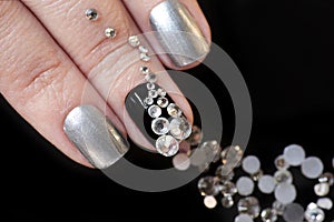 Black silver manicure on short nails with a design