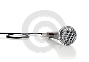 Black and silver microphone on a white background