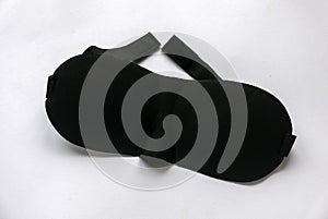 Black sleeping eye mask isolated on white background