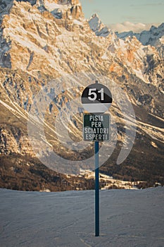 Black slope warning sign