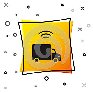 Black Smart delivery cargo truck vehicle with wireless connection icon isolated on white background. Yellow square