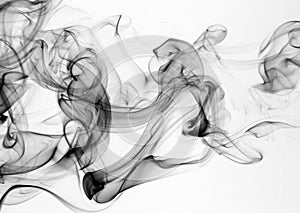 Black smoke motion on white background. movement of smoke abstract fire design