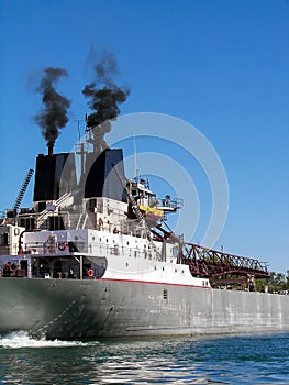 Black smoke from smokestack on freighter
