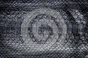 Black snake skin pattern texture. Black reptile. Python leather background.
