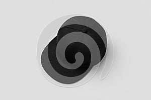 Black snapback cap mockup on a grey background