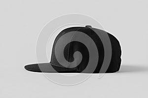 Black snapback cap mockup on a grey background, side view