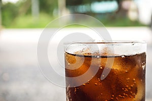 Black soft drink in glass. On marble floor. Favorite soft drink