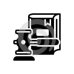 Black solid icon for Legislation, hammer and book