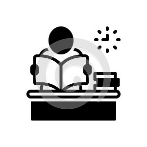 Black solid icon for Reading, study table and classwork