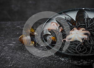 Black spaghetti pasta with octopus and mussels