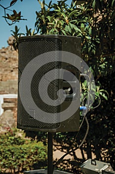 Black speaker on a garden at the Roman Theater of Merida