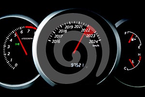 Black speedometer with cutoffs 2022, 2023, 2024. The concept of the new year and Christmas in the automotive field. Counting