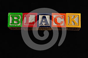 Black spelled with colorful blocks