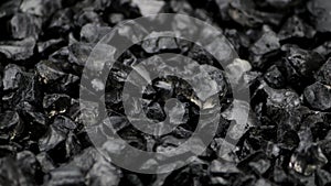 Black split stones rotate on a turntable