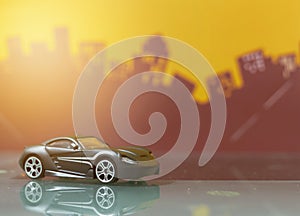 Black Sport car toy selective focus on blur city background