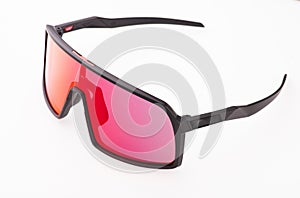 Black sports glasses on white background. Side view. Space for text