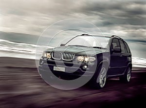 Black Sports Wagon on Beach