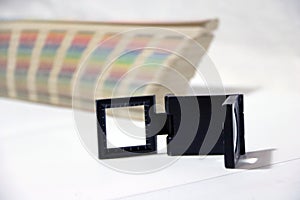 Black square Magnifying glass and Rainbow Sample Colors Palette Catalog.