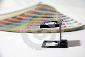 Black square Magnifying glass and Rainbow Sample Colors Palette Catalog.