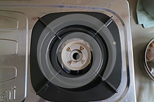 Black square placemats on the gas stove