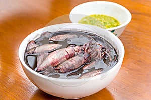 Black squid boiled with seafood sauces