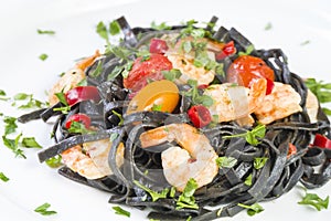 Black squid ink Fettuccine pasta with prawns or shrimps cherry tomatoes, parsley, chili in wine and butter sauce