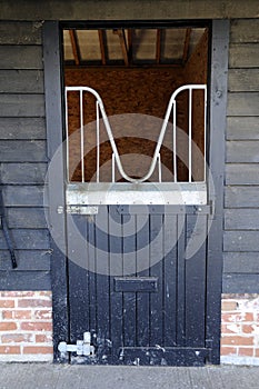 Black stable door, at equine barn.