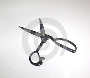 A black stainless steel scissors isolated on white background