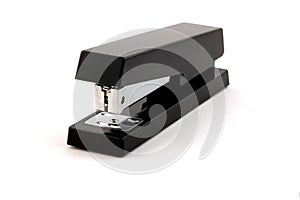 Black stapler isolated on pure white