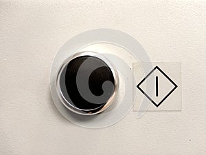 Black start button, white background.