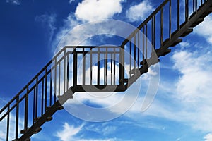 black steel stairs with blue sky