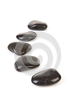 Black stepping stones in a row