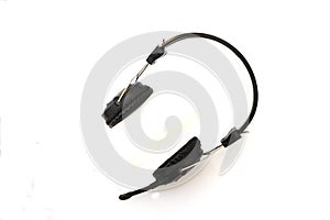 Black stereo headphones with microphone on white background.