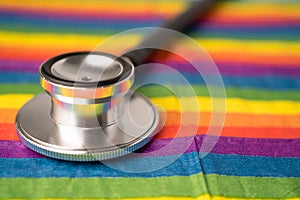 Black stethoscope on rainbow background, symbol of LGBT pride month  celebrate annual in June social, symbol of gay, lesbian, gay