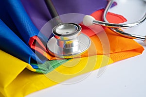 Black stethoscope on rainbow flag background, symbol of LGBT pride month  celebrate annual in June social, symbol of gay, lesbian