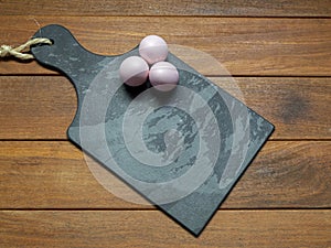 Black stone board with easter eggs with space for text