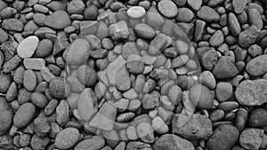 Black stone, Shiny black lava pebbles on the beach