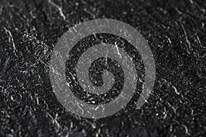 Black stone texture as abstract background, design material and textured surface