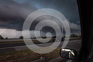 Black storm clouds above highway