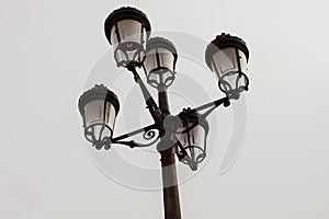 Black streetlight with five lamps