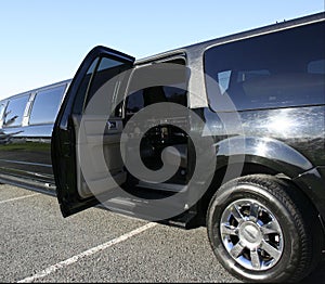 Black stretch limo with door open
