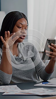 Black student chatting with math professor explaining online maths lesson using university platform