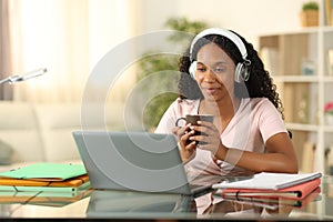 Black student e-learning and drinking at home
