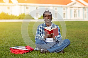 Black Student Guy Learning Reading Book Sitting Outdoors Of University