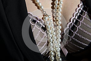 Black, stylised bra with pearls