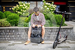 Black stylish retro vintage backpack. Bag with leather trim, roll-top clasp. Urban rucksack. Travel haversack. Drawstring knapsack photo