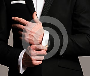 Black suit. Man cufflinks. Gentleman business look. Elegant and stylish clothes. Male fashion.