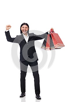 The black suit man holding plastic bags isolated on white